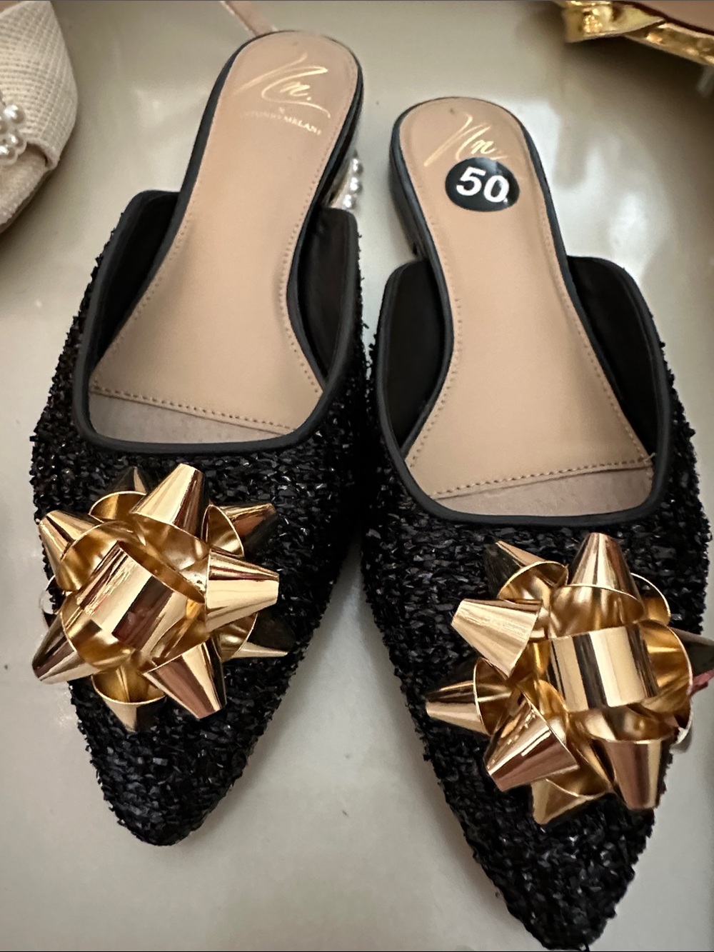 ANTONIO MELANI Black Pointed Mule Flats with Gold Bow Detail